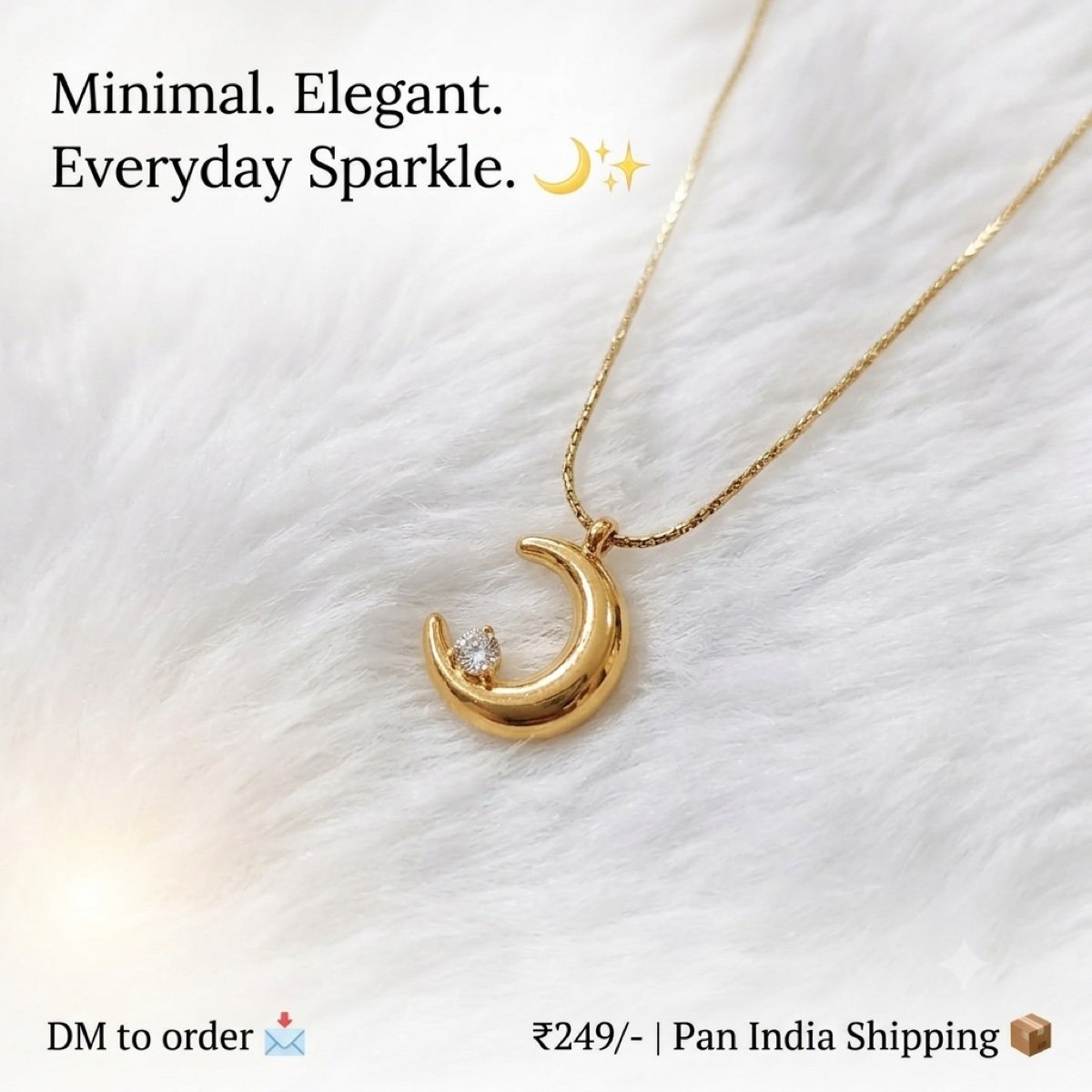 Gold-tone crescent moon pendant with a single stone, on a fine chain